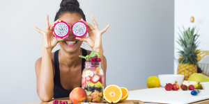 woman smiling with fruit
