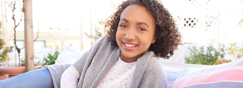 A woman smiling