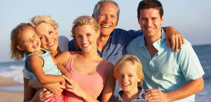 Photo of a an entire family on a beach